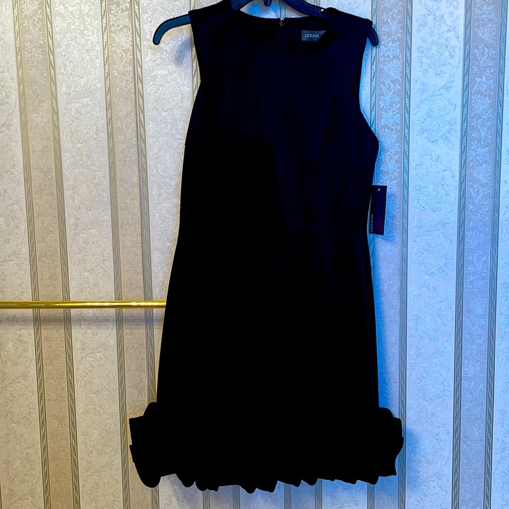 Donna Karan all- eyes-on -you Black sheath with wife ribboned bottom. Gorgeous